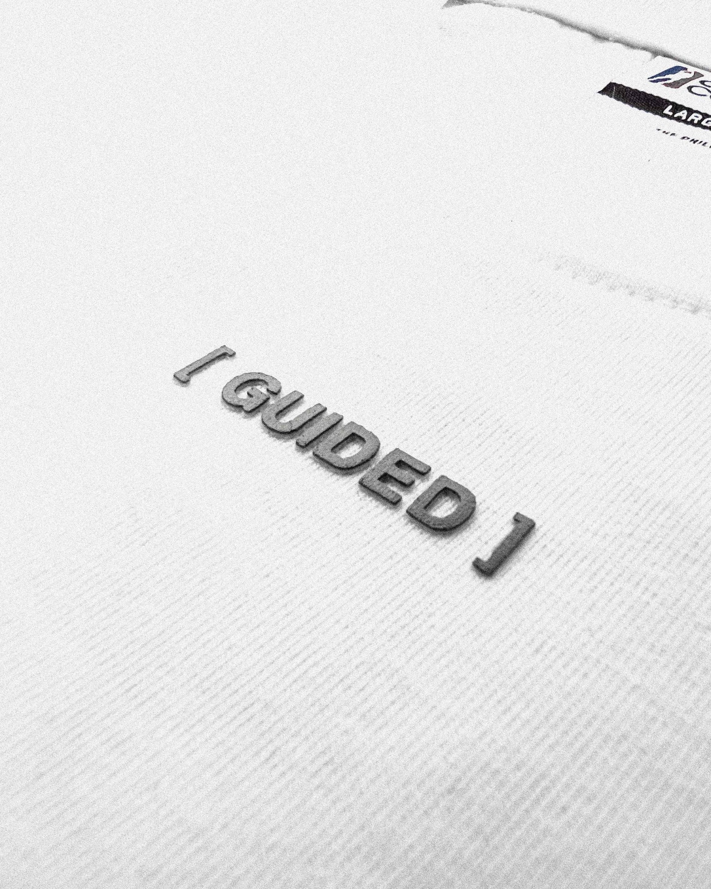 "Guided" Manifesto Off-White Statement Tee